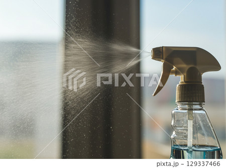Spray Bottle Cleaning Window, Closeup 129337466