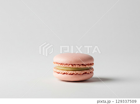 Pink Macaron with Green Cream Filling on White Background 129337509
