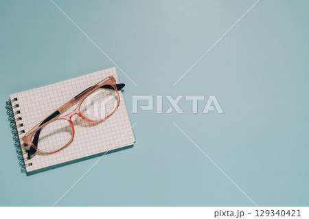 Pink Glasses on Notepad, Study, Vision and Creative Workspace 129340421