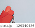 Red Wallet with Heart and Keychain on Blue Background 129340426