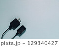 Black Charger and Plug on Blue, Power and Connectivity Concept 129340427