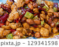 Delicious kung pao chicken served with peanuts and chilies in Du 129341598