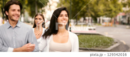 Cheating Boyfriend. Desperate Girl Meeting Her Man Dating With Other Woman Walking Outside In Park. Selective Focus 129342016