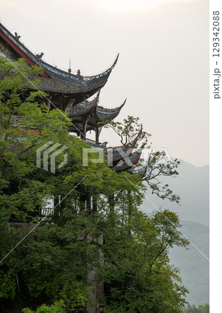 Traditional architecture among lush greenery in DuJiangYan 129342088