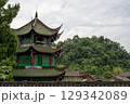 Vibrant traditional architecture against a lush green backdrop i 129342089