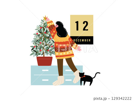 クリスマスの飾り付けをする女性 129342222