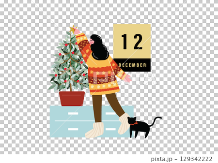 クリスマスの飾り付けをする女性 129342222