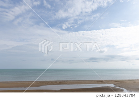 Peaceful landscape with a sandy shoreline, calm sea waters, Caspian Sea coast 129343704