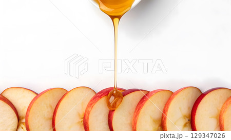 Delicious apple slices being drizzled with golden honey for a tasty treat 129347026