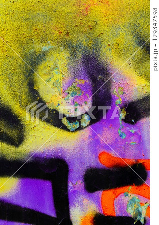 Vibrant Urban Graffiti Art with Neon Yellow, Purple, Orange Accents 129347598