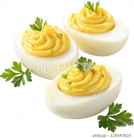 Creamy and savory deviled eggs garnished with parsley make a classic and appetizing finger food 129347819