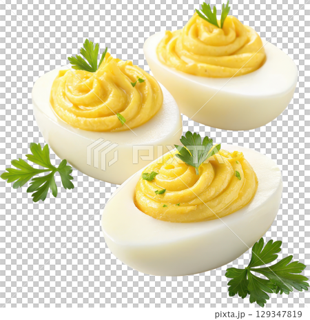Creamy and savory deviled eggs garnished with parsley make a classic and appetizing finger food 129347819