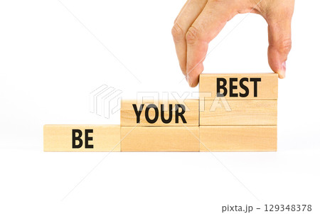 Motivational be your best symbol. Concept words Be your best on beautiful wooden blocks. Beautiful white table white background. Businessman hand. Business motivational be your best concept Copy space 129348378