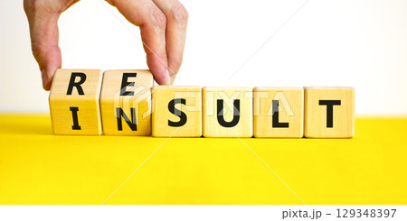 Result or insult symbol. Concept words Result Insult on wooden cubes. Beautiful yellow table white background. Businessman hand. Business and result or insult concept. Copy space. 129348397
