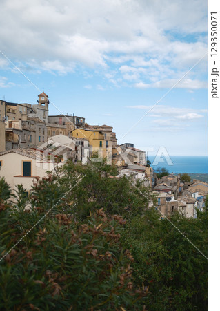 Clouds And Blue Sky Over The Small Town In Italy 129350071