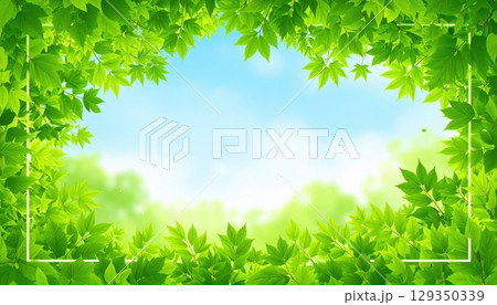 Lush green foliage and grass frame a serene nature background under a clear sky, embodying the fresh beauty of a spring or summer season Lush green foliage and grass frame a serene nature background under a clear sky, embodying the fresh beauty of a spring or summer season 129350339