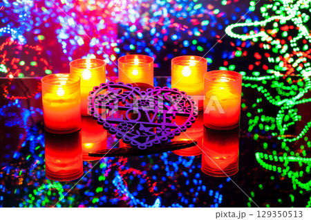 The burning candles bring warmth and tenderness to the frame. The burning candles bring warmth and tenderness to the frame. 129350513