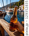 Chilled Croatian beer enjoyed by the sea on a sunny vacation 129352835