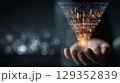 Hands present a marketing funnel with digital data overlay 129352839