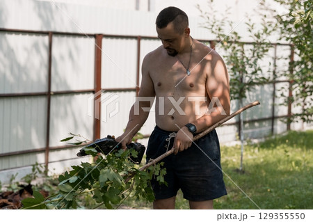 Shirtless Man Gardening with Chainsaw Trimmer, Outdoor Yard Work, Green Trees, Brown Fence, Summer, Sunny Daylight, Realistic Photography Shirtless Man Gardening with Chainsaw Trimmer, Outdoor Yard Work, Green Trees, Brown Fence, Summer, Sunny Daylight, Realistic Photography 129355550
