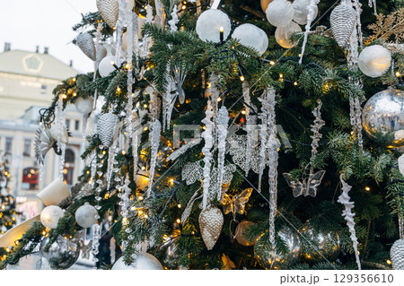 New Year's colorful trees in front of the Central Department Store in Moscow on Kuznetsky Most 129356610