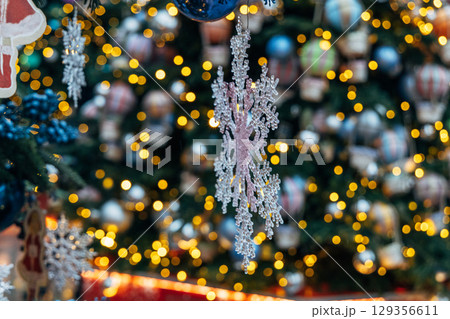 New Year's colorful trees in front of the Central Department Store in Moscow on Kuznetsky Most New Year's colorful trees in front of the Central Department Store in Moscow on Kuznetsky Most 129356611