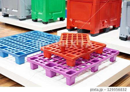 Plastic colored pallets at store 129356832