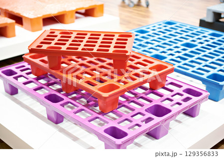 Plastic colored pallets at store Plastic colored pallets at store 129356833
