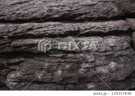Natural ancient stone rock wall texture 129357646