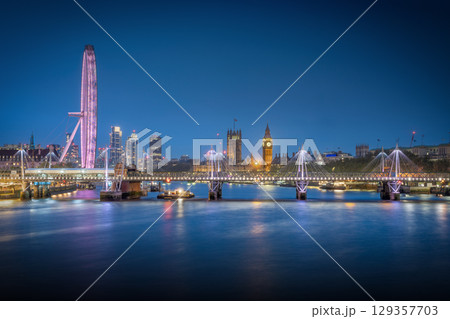 Waterloo Bridge view at blue hour with Big Ben, Westminster and London Eye 129357703