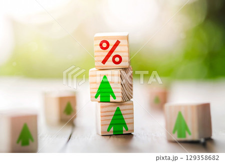 Interest rate financial and mortgage rates concept. Wooden cube block with interest rate and up arrow. 129358682