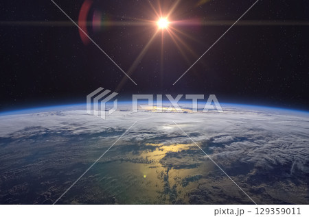 Sunrise over planet Earth, view from space. Space scene. Sunrise over planet Earth, view from space. Space scene. 129359011