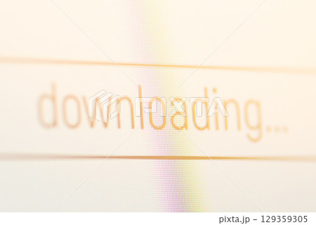 Downloading icon on computer screen. Concept of downloading files from the Internet to personal computer 129359305