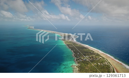 French Polynesia, Rangiroa island: Blending turquoise and blue waters with lush greenery. Drone flight French Polynesia, Rangiroa island: Blending turquoise and blue waters with lush greenery. Drone flight 129361713