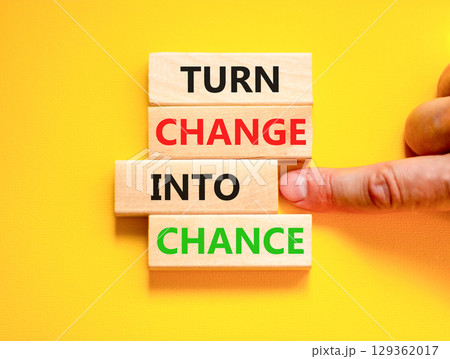 Turn change into chance symbol. Concept words phrase Turn change into chance on beautiful wooden blocks. Beautiful yellow paper background. Business Turn change into chance concept. Copy space. Turn change into chance symbol. Concept words phrase Turn change into chance on beautiful wooden blocks. Beautiful yellow paper background. Business Turn change into chance concept. Copy space. 129362017