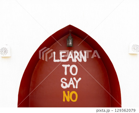 Learn to say no symbol. Concept words phrase Learn to say no on beautiful brown wall. Beautiful white wall background. Business psychological Learn to say no concept. Copy space. Learn to say no symbol. Concept words phrase Learn to say no on beautiful brown wall. Beautiful white wall background. Business psychological Learn to say no concept. Copy space. 129362079