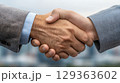 Business handshake symbolizing partnership and agreement 129363602