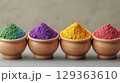 Vibrant colored powders in wooden bowls create stunning display 129363610
