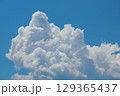 Cumulonimbus Cloud Formation Against Clear Blue Sky 129365437