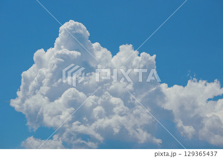 Cumulonimbus Cloud Formation Against Clear Blue Sky Cumulonimbus Cloud Formation Against Clear Blue Sky 129365437