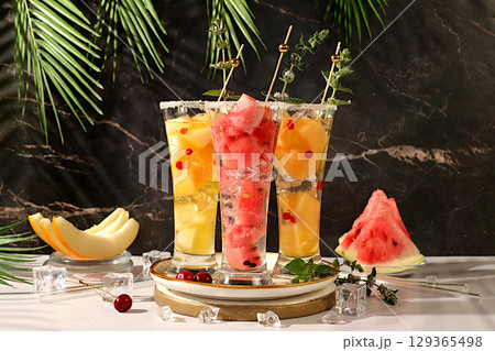 Lemonade with watermelon, melon, currant, mint, Refreshing summer homemade cocktail, sangria, weight loss concept, healthy and natural nutrition, detox water with fruit flavor on a light background Lemonade with watermelon, melon, currant, mint, Refreshing summer homemade cocktail, sangria, weight loss concept, healthy and natural nutrition, detox water with fruit flavor on a light background 129365498