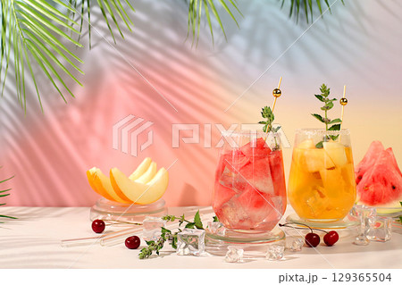 Lemonade with watermelon, melon, currant, mint, Refreshing summer homemade cocktail, sangria, weight loss concept, healthy and natural nutrition, detox water with fruit flavor on a light background Lemonade with watermelon, melon, currant, mint, Refreshing summer homemade cocktail, sangria, weight loss concept, healthy and natural nutrition, detox water with fruit flavor on a light background 129365504