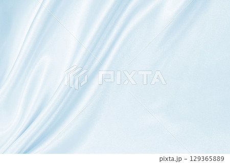 Smooth elegant blue silk or satin luxury cloth texture as abstract background. Luxurious background design 129365889