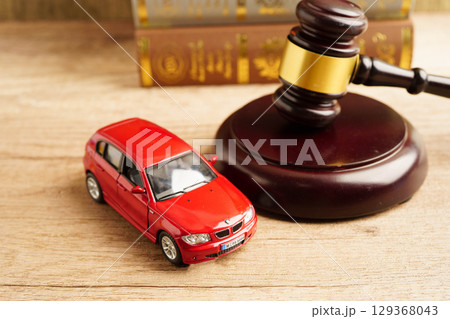 Bangkok, Thailand March 15, 2023 Car accident lawsuit and insurance, Judge hammer with car model. Bangkok, Thailand March 15, 2023 Car accident lawsuit and insurance, Judge hammer with car model. 129368043