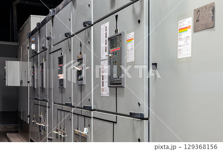 Perspective side view of Control panel system integration inside of Electric voltage control room. 129368156