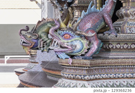 Statues of character that mixes modern anime and cartoons with historical folklore made from plaster decorated exterior the chapel. 129368236