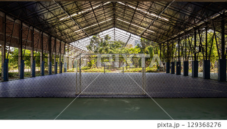 Soccer goal or Football gate with white net inside indoor Futsal court at city park. Soccer goal or Football gate with white net inside indoor Futsal court at city park. 129368276