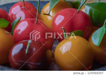 Deletable imitation fruits (Kanom look choup) has a sweet taste. 129368307