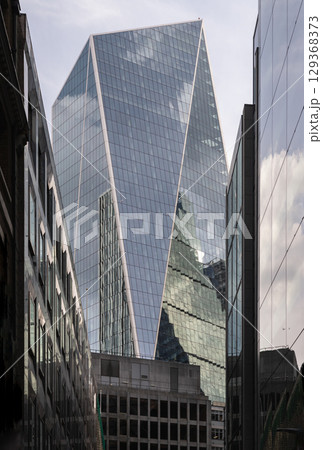 a striking perspective of The Scalpel building, characterized by its sharp, angular, and geometric design, standing as a prominent commercial skyscraper. 129368373