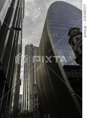 70 St Mary Axe known as "The Can of Ham" a distinctive modern buildings with a curved design and the iconic 30 St Mary Axe "The Gherkin". 70 St Mary Axe known as "The Can of Ham" a distinctive modern buildings with a curved design and the iconic 30 St Mary Axe "The Gherkin". 129368557